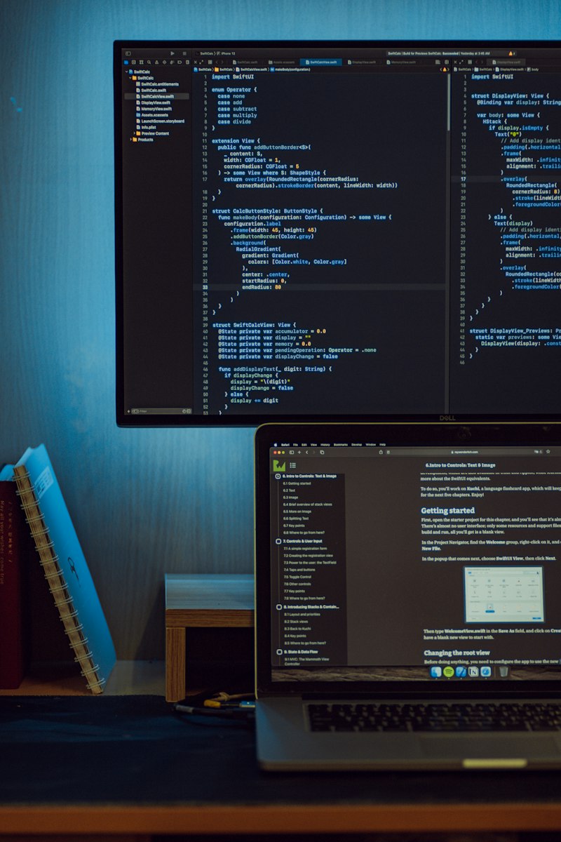 Developer writing code on a laptop